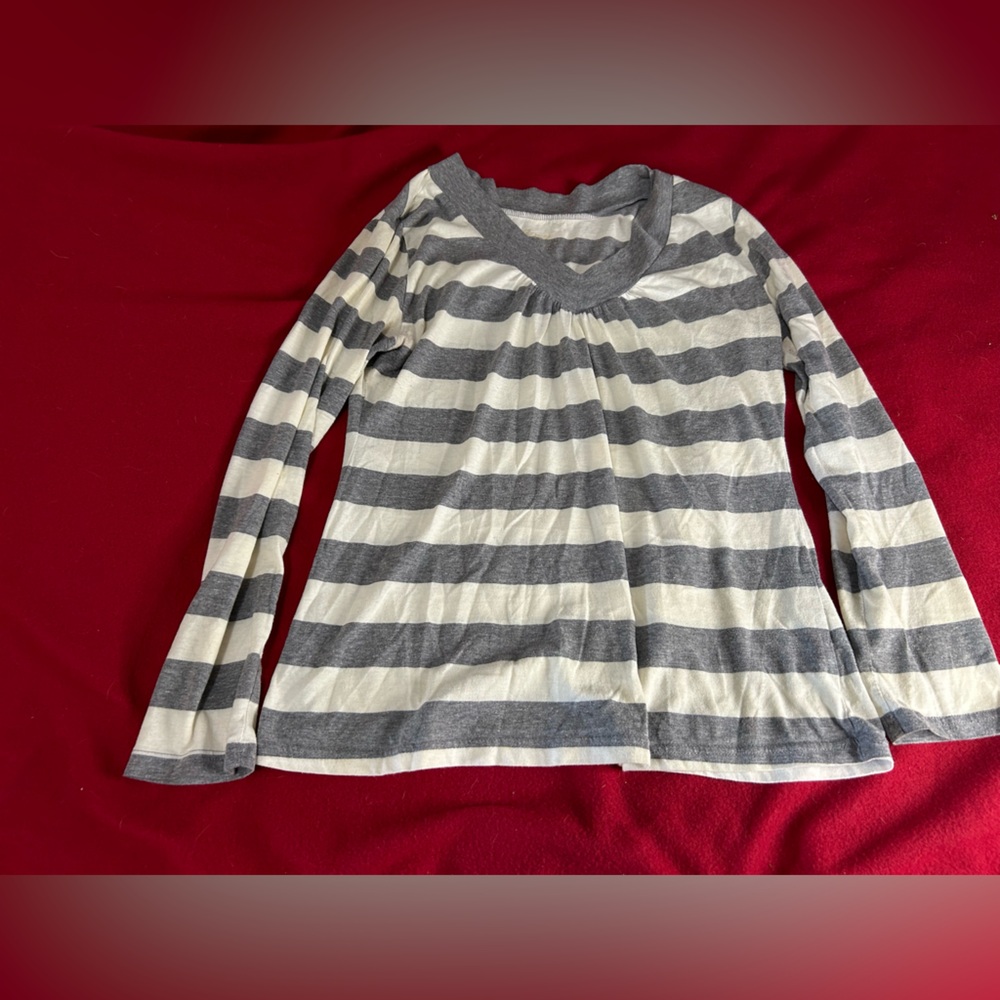 Grey and white stripped v-neck shirt